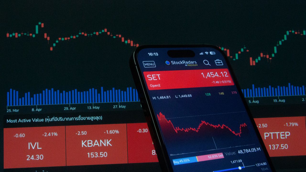 services-img Mobile app showing stock market data with charts on screen.